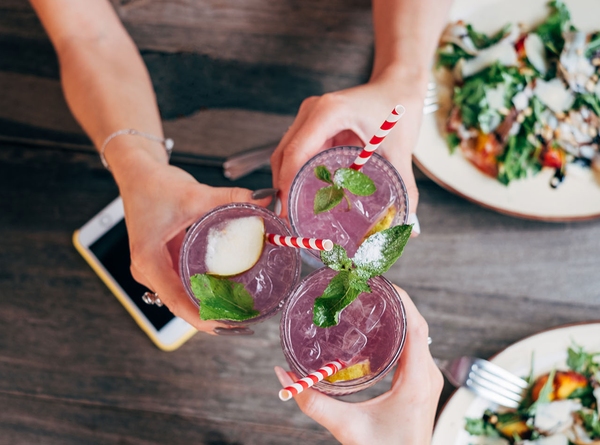 Friends toasting at dinner table